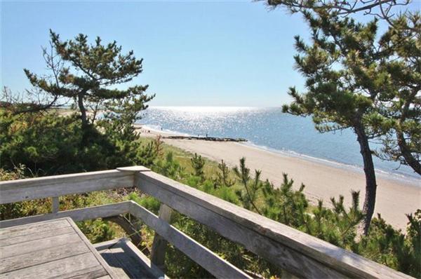 89 Shore Road Harwich, MA 02671 - Photo 4 of 20 a wooden bench sitting in front of a yard