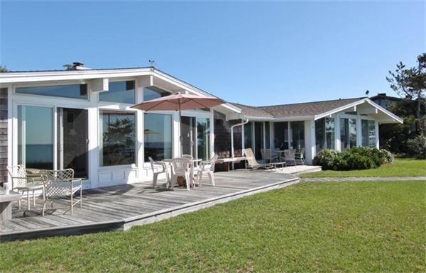 89 Shore Road Harwich, MA 02671 - Photo 5 of 20 a front view of house with yard and outdoor seating