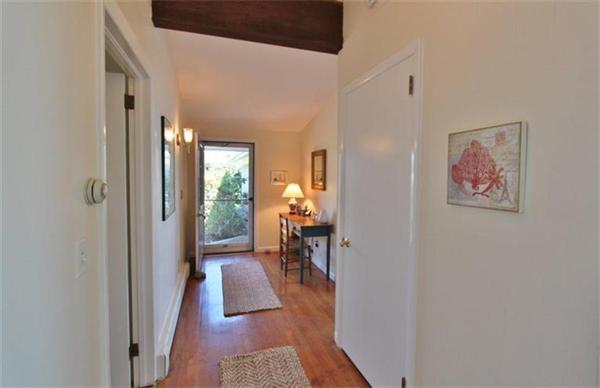 89 Shore Road Harwich, MA 02671 - Photo 7 of 20 a hallway with a dining table and a workspace