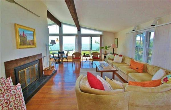 89 Shore Road Harwich, MA 02671 - Photo 8 of 20 a living room with furniture and a fireplace