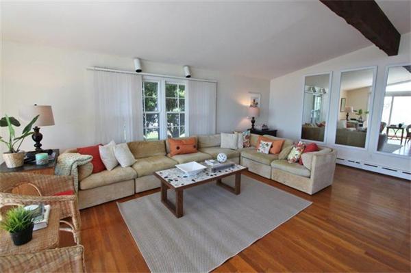 89 Shore Road Harwich, MA 02671 - Photo 9 of 20 a living room with furniture and a large window