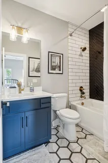 a bathroom with a toilet a sink and bathtub