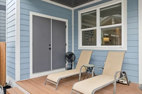 a bedroom with furniture and a window
