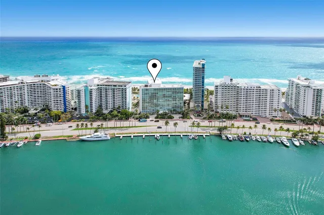a view of swimming pool with outdoor seating and city view
