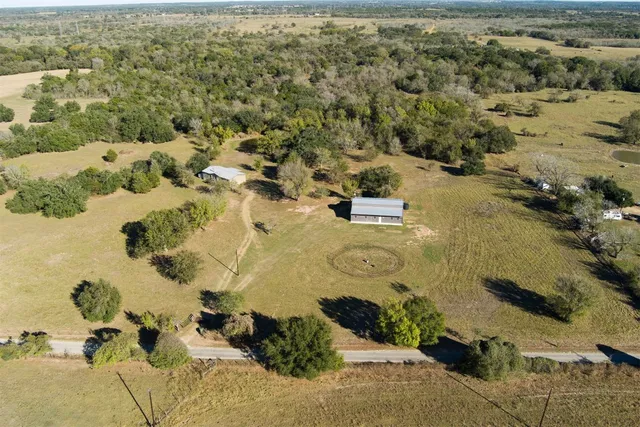 an aerial view of residential house with beach