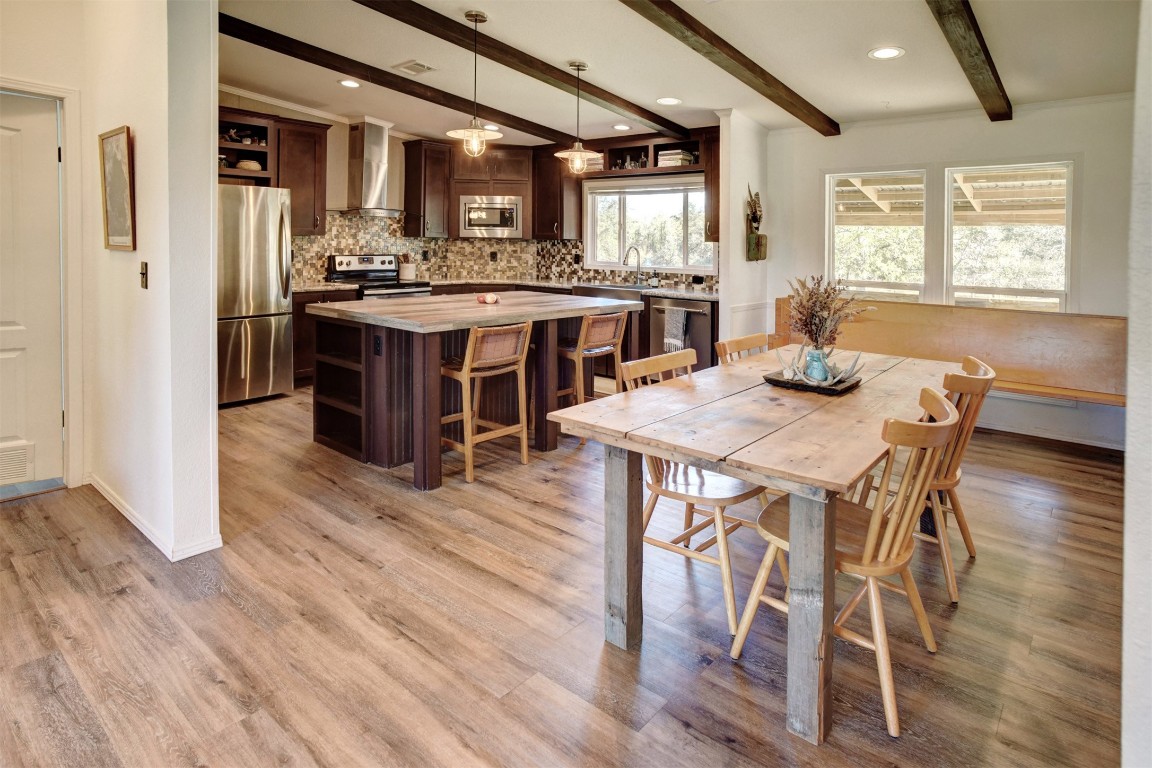 421 Krchnak Road Smithville, TX 78957 - Photo 12 of 40 a view of a dining room with furniture window and wooden floor