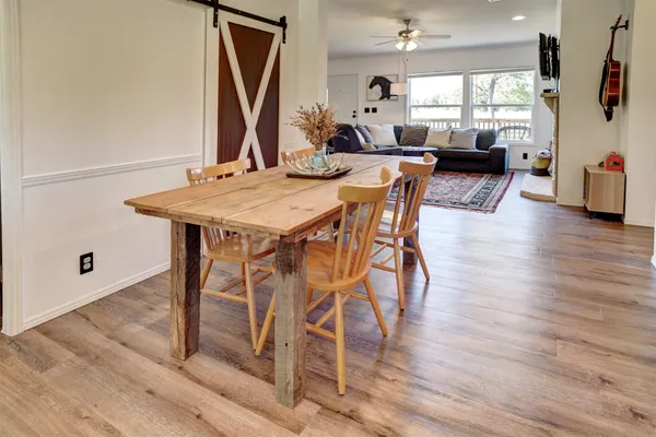 a dining room with a table and chairs