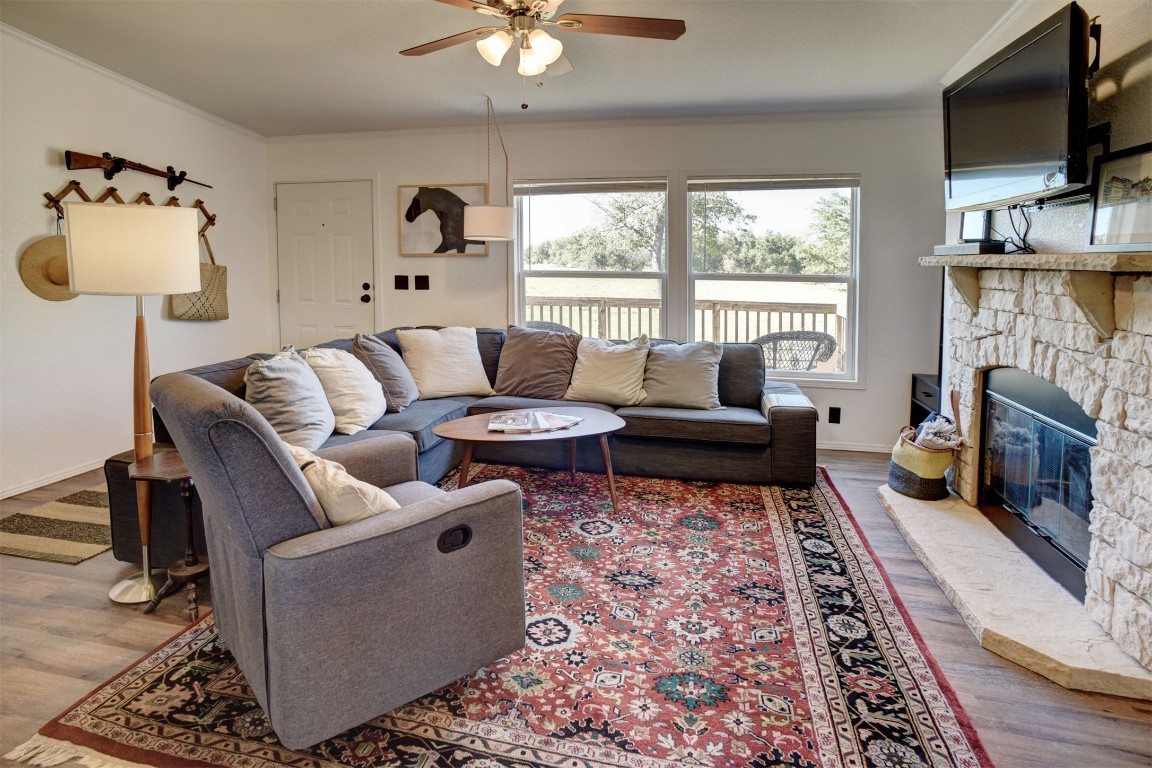 421 Krchnak Road Smithville, TX 78957 - Photo 16 of 40 a living room with furniture fireplace and flat screen tv