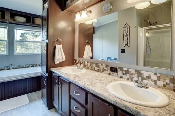 a bathroom with a bathtub and window
