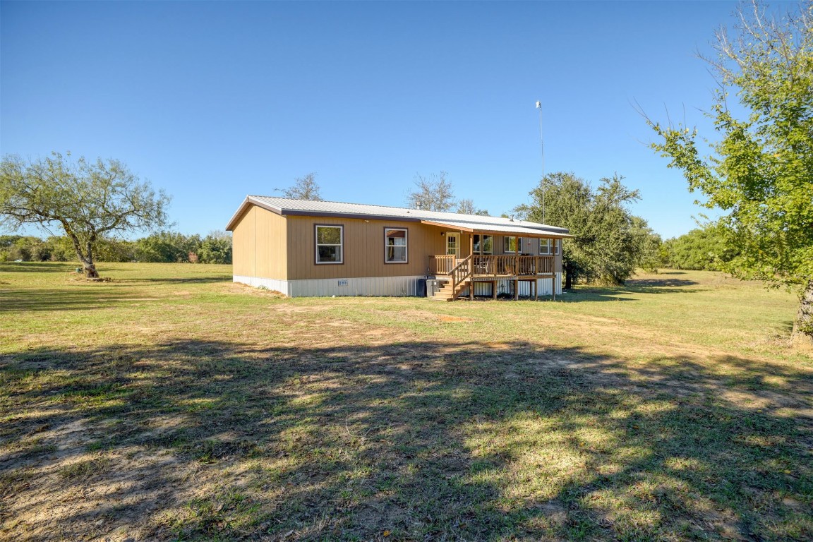 421 Krchnak Road Smithville, TX 78957 - Photo 26 of 40 a front view of a house with a yard
