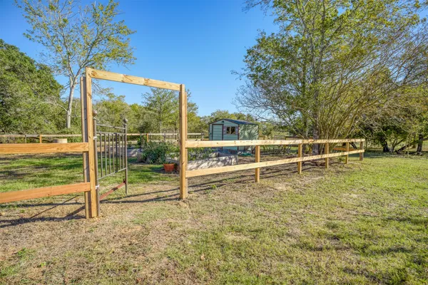 a view of a backyard with sitting area