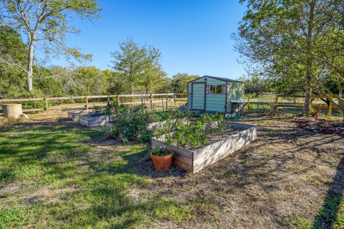421 Krchnak Road Smithville, TX 78957 - Photo 31 of 40 a view of a backyard with sitting area
