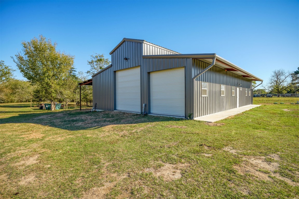 421 Krchnak Road Smithville, TX 78957 - Photo 6 of 40 a view of an house with backyard and tree