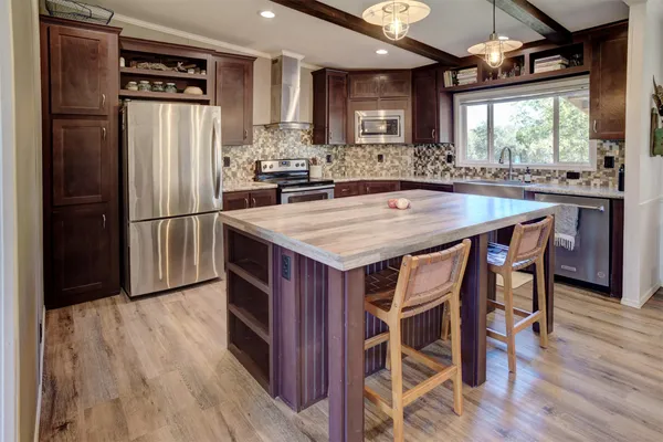 a kitchen with a stove and a sink