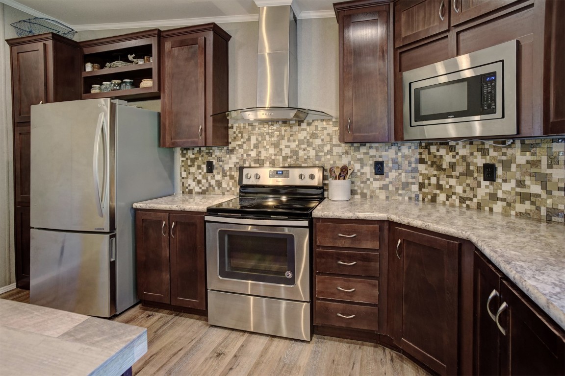 421 Krchnak Road Smithville, TX 78957 - Photo 10 of 40 a kitchen with stainless steel appliances granite countertop a refrigerator stove and sink