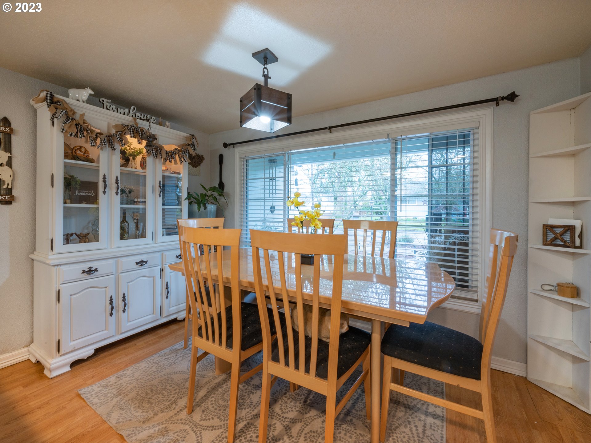 820 West Fairview Drive Springfield, OR 97477 - Photo 7 of 32 a view of a dining room with furniture large windows and wooden floor