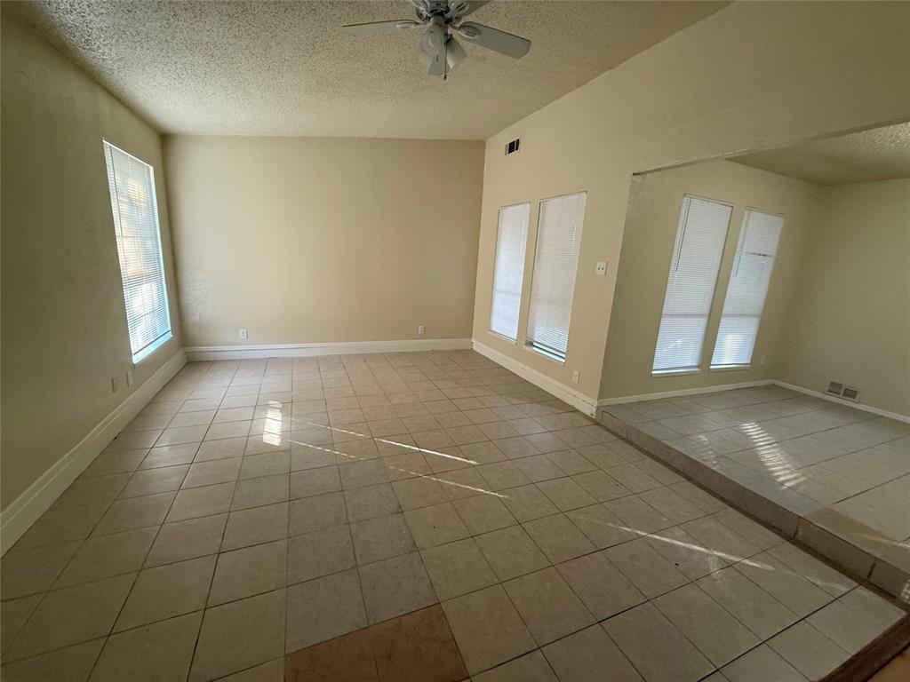 5005 Galaxie Road Garland, TX 75044 - Photo 8 of 8 a view of an empty room and window