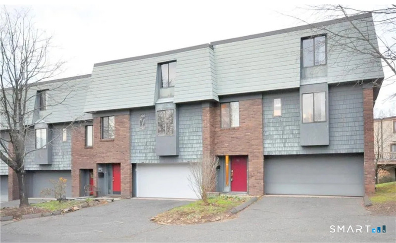 91 Trolley Crossing Lane, Unit 91 Middletown, CT 06457 - Photo 1 of 29 a front view of a house with a garage