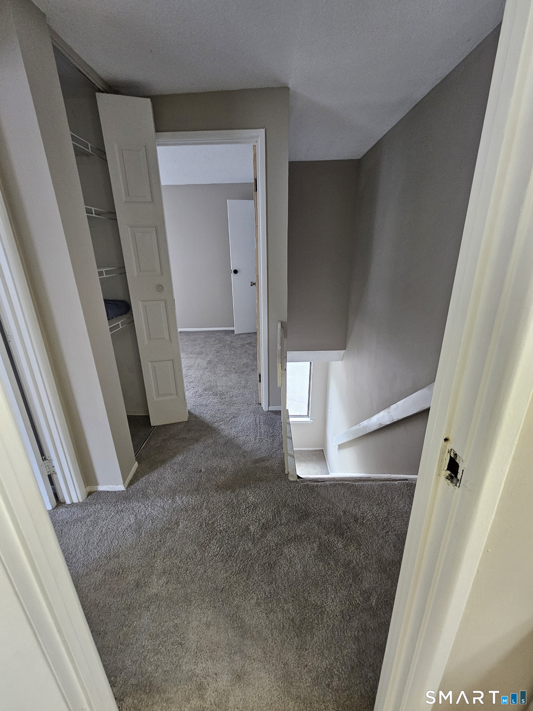 91 Trolley Crossing Lane, Unit 91 Middletown, CT 06457 - Photo 15 of 29 a view of a livingroom with a staircase