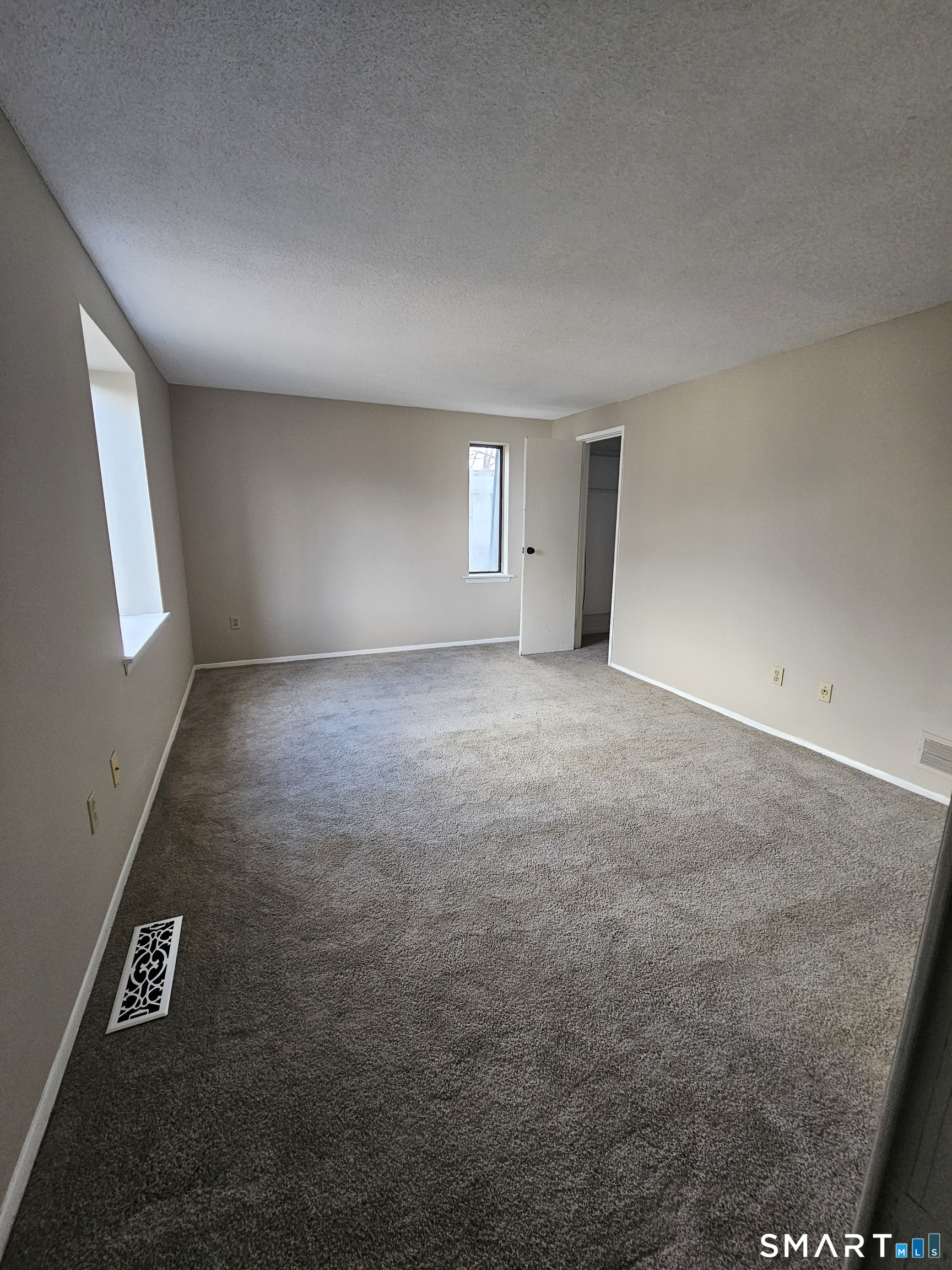 91 Trolley Crossing Lane, Unit 91 Middletown, CT 06457 - Photo 23 of 29 an empty room with windows