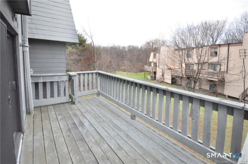 91 Trolley Crossing Lane, Unit 91 Middletown, CT 06457 - Photo 27 of 29 a view of wooden deck