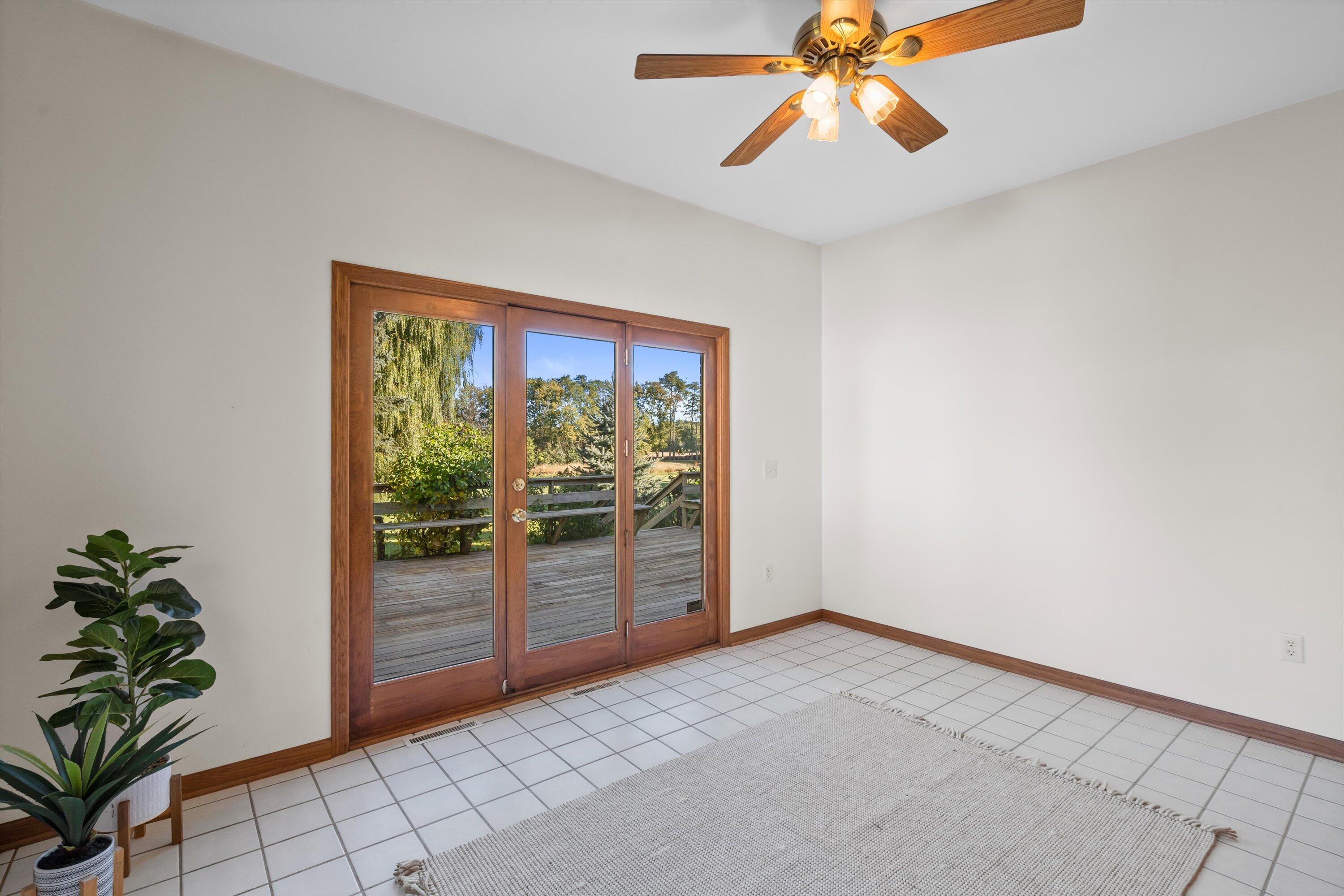 7306 Forty Acre Road Caledonia, WI 53126 - Photo 22 of 45 Sunroom with Doors to Deck