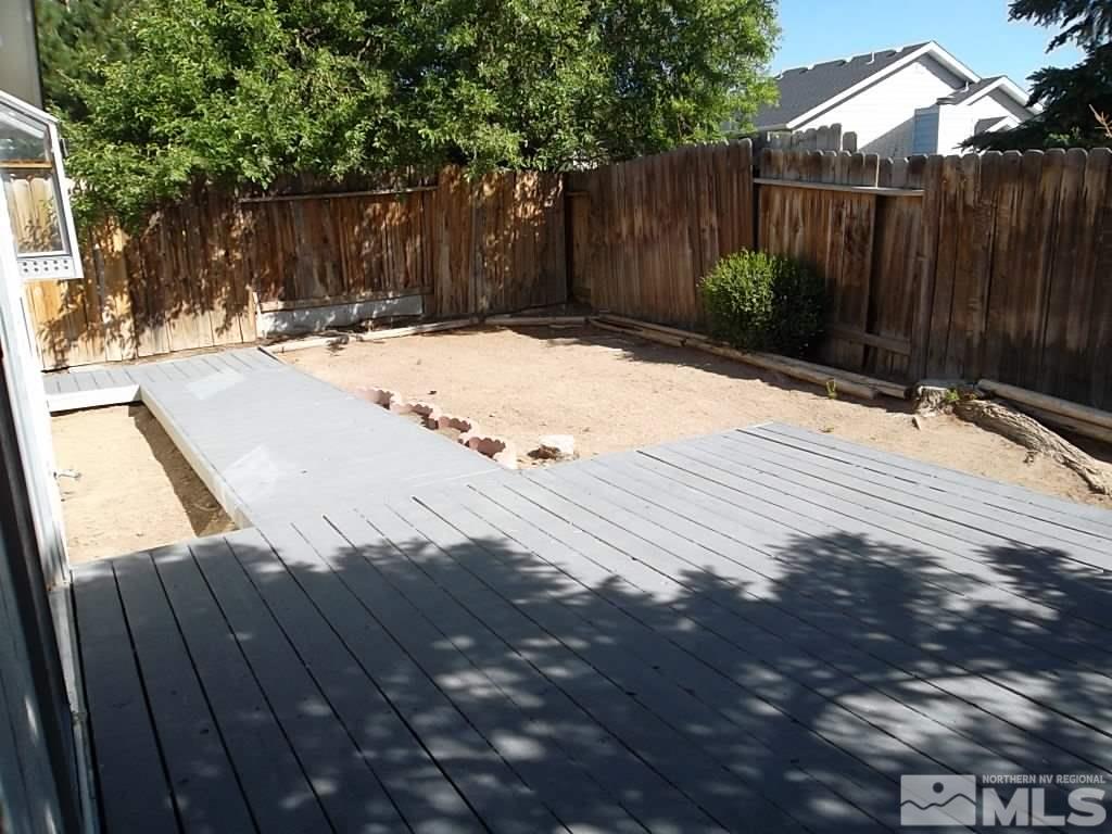 6129 Walnut Creek Road Reno, NV 89523 - Photo 12 of 15 a view of wooden fence and trees in the background