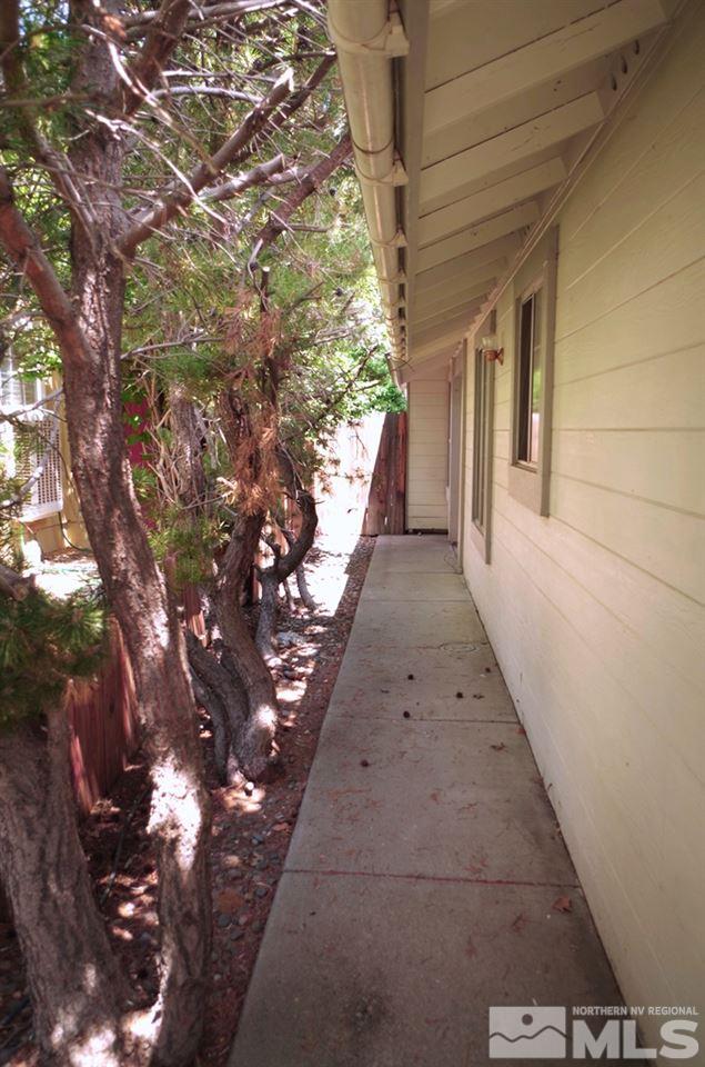 6129 Walnut Creek Road Reno, NV 89523 - Photo 3 of 15 a view of a pathway both side of house
