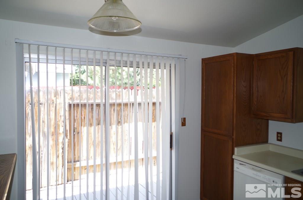 6129 Walnut Creek Road Reno, NV 89523 - Photo 6 of 15 a room with a large window and dining space