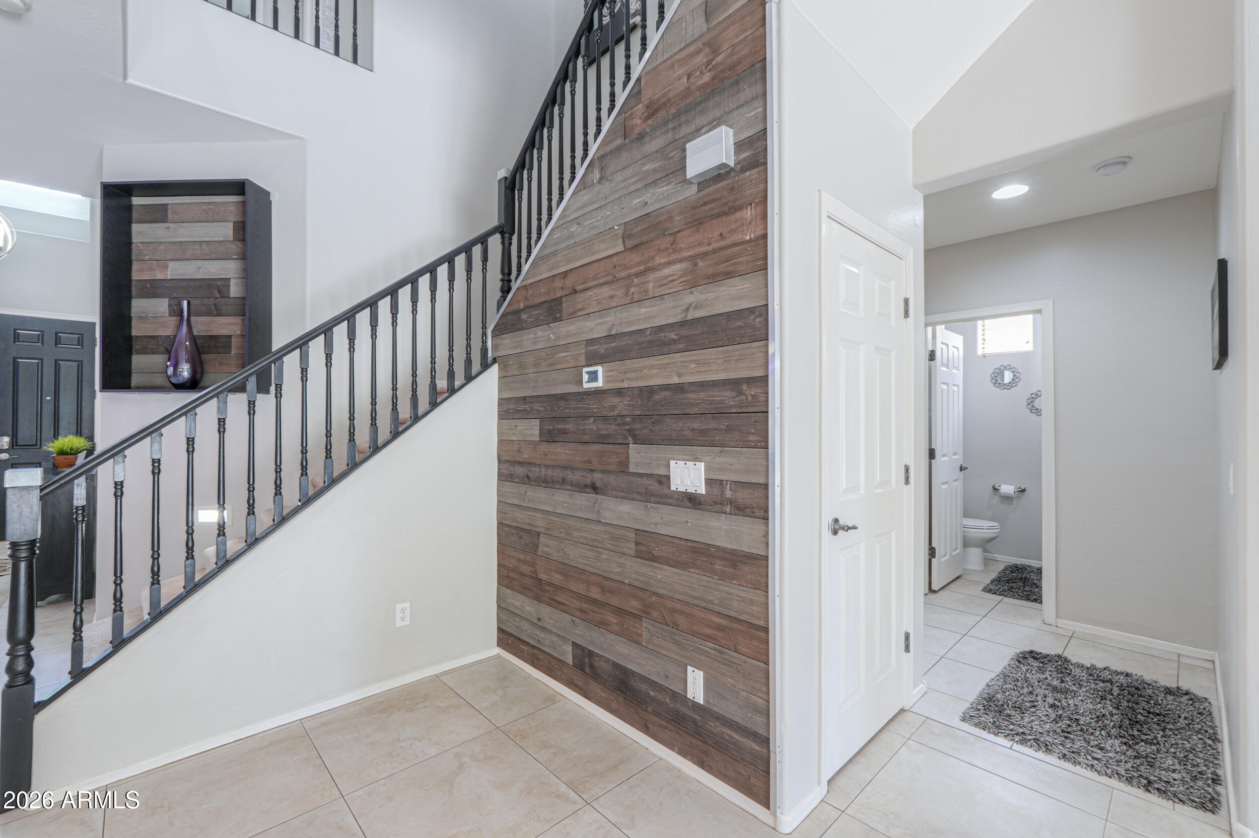 45247 West Jack Rabbit Trail Maricopa, AZ 85139 - Photo 25 of 75 a view of an entryway with staircase