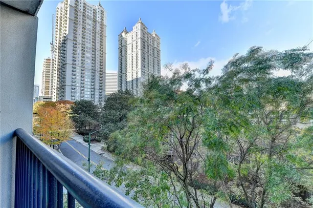 a view of a balcony with a tree