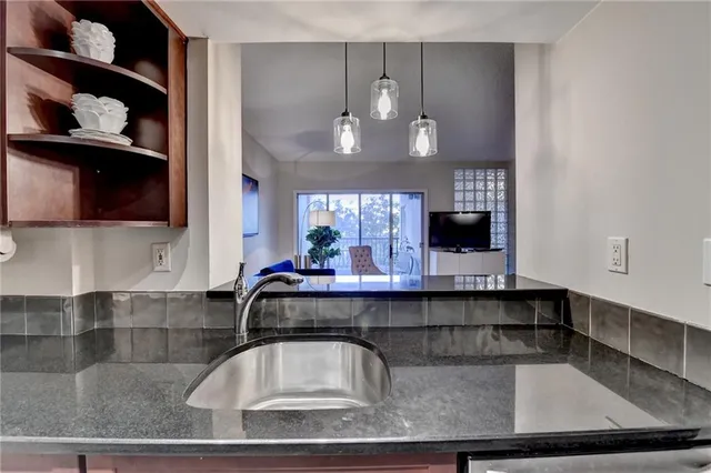 a kitchen with a sink and cabinets