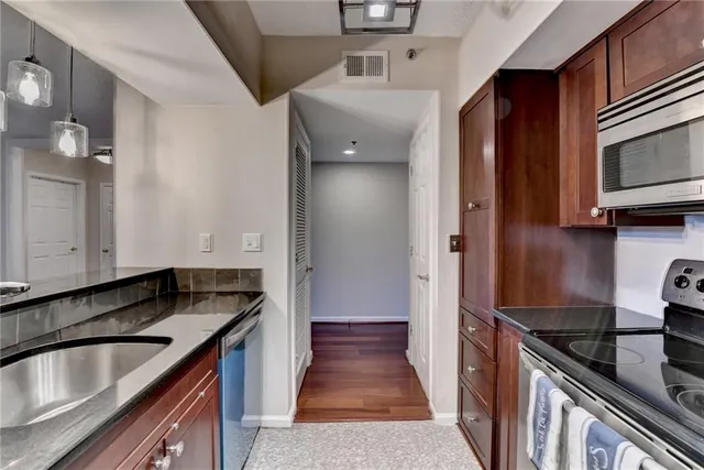 a kitchen that has a sink and a stove