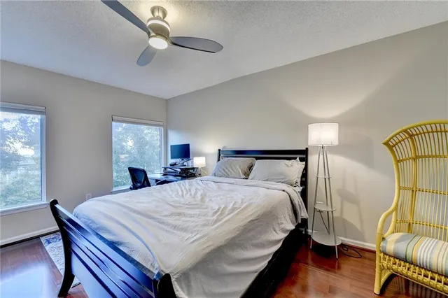 a bed room with a bed and a chandelier