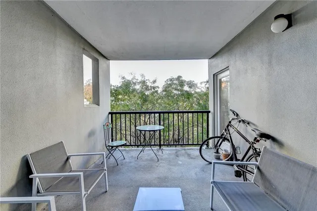 a view of a livingroom with furniture and hardwood floor