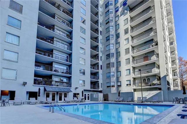 a view of a building with a swimming pool