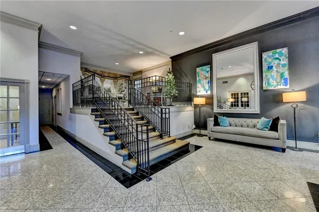 a living room with lots of furniture and white walls