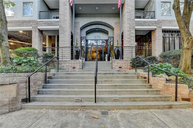 a front view of a house with stairs