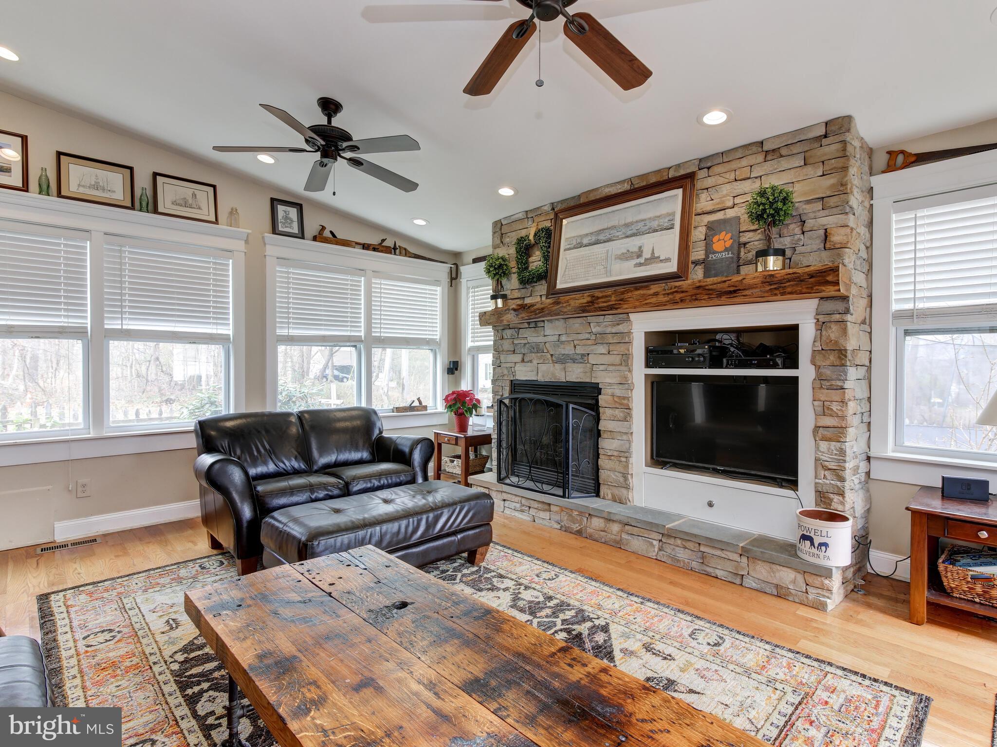 101 Sproul Road Malvern, PA 19355 - Photo 19 of 49 Sunroom with fireplace, stone accent and built ins