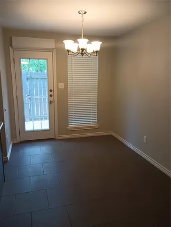 a view of a chandelier in an empty room