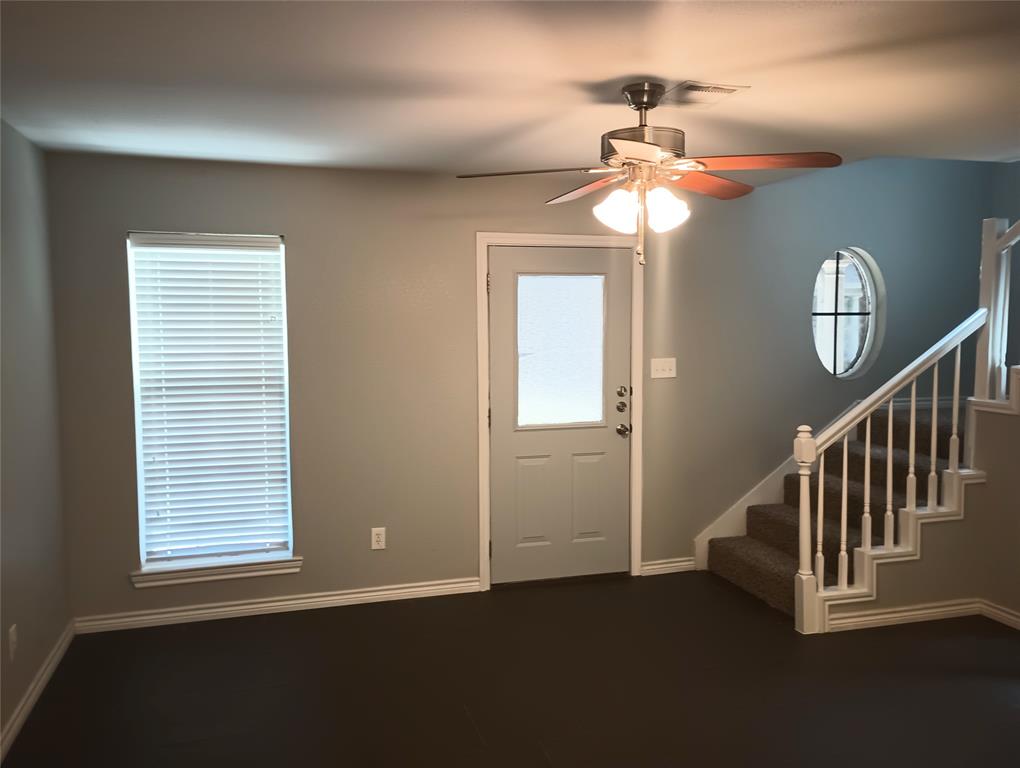 2004 Pecan Street, Unit G Commerce, TX 75428 - Photo 6 of 10 Foyer featuring stairway and ceiling fan