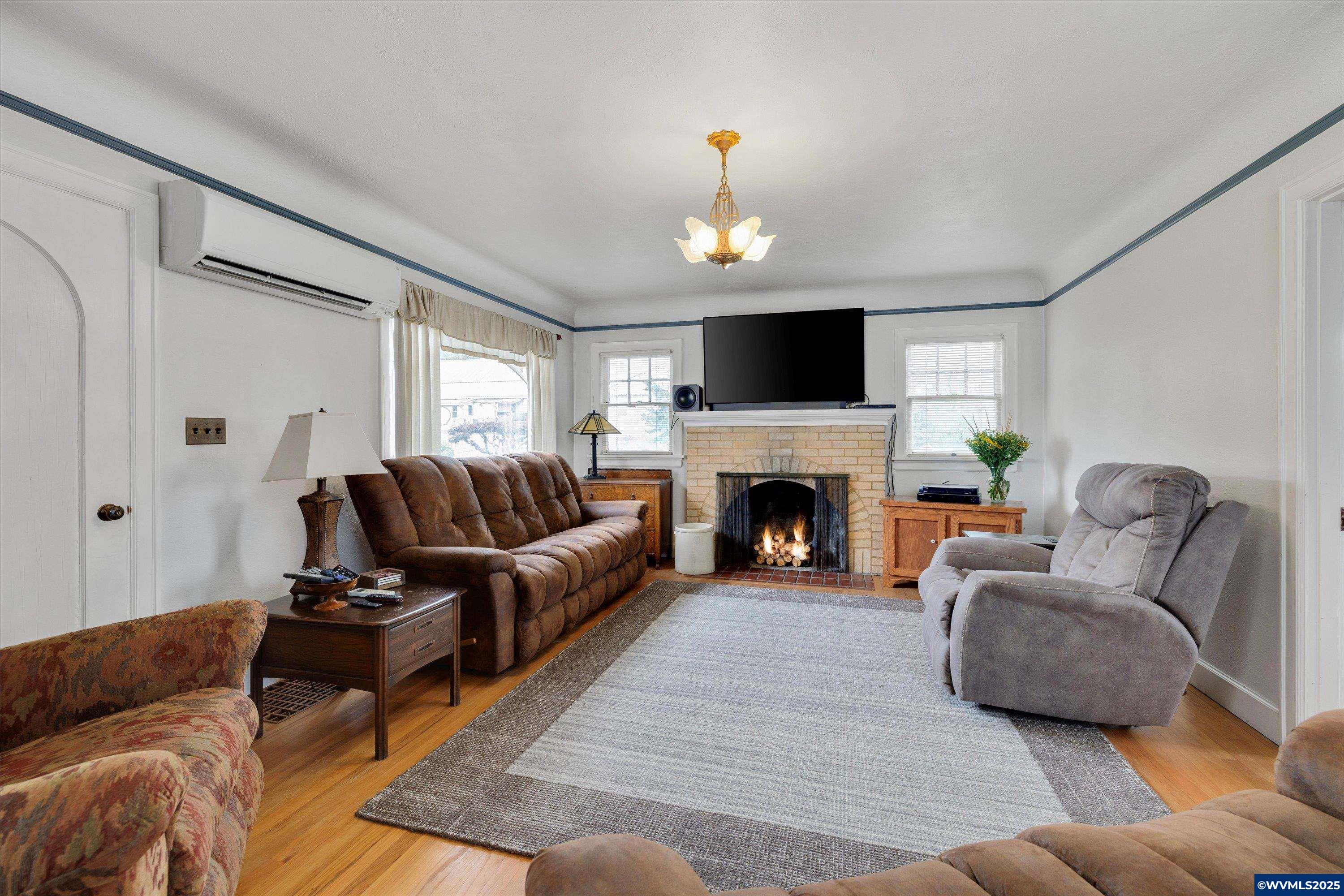 21303 South Central Point Road Canby, OR 97013 - Photo 38 of 50 a living room with furniture and a fireplace