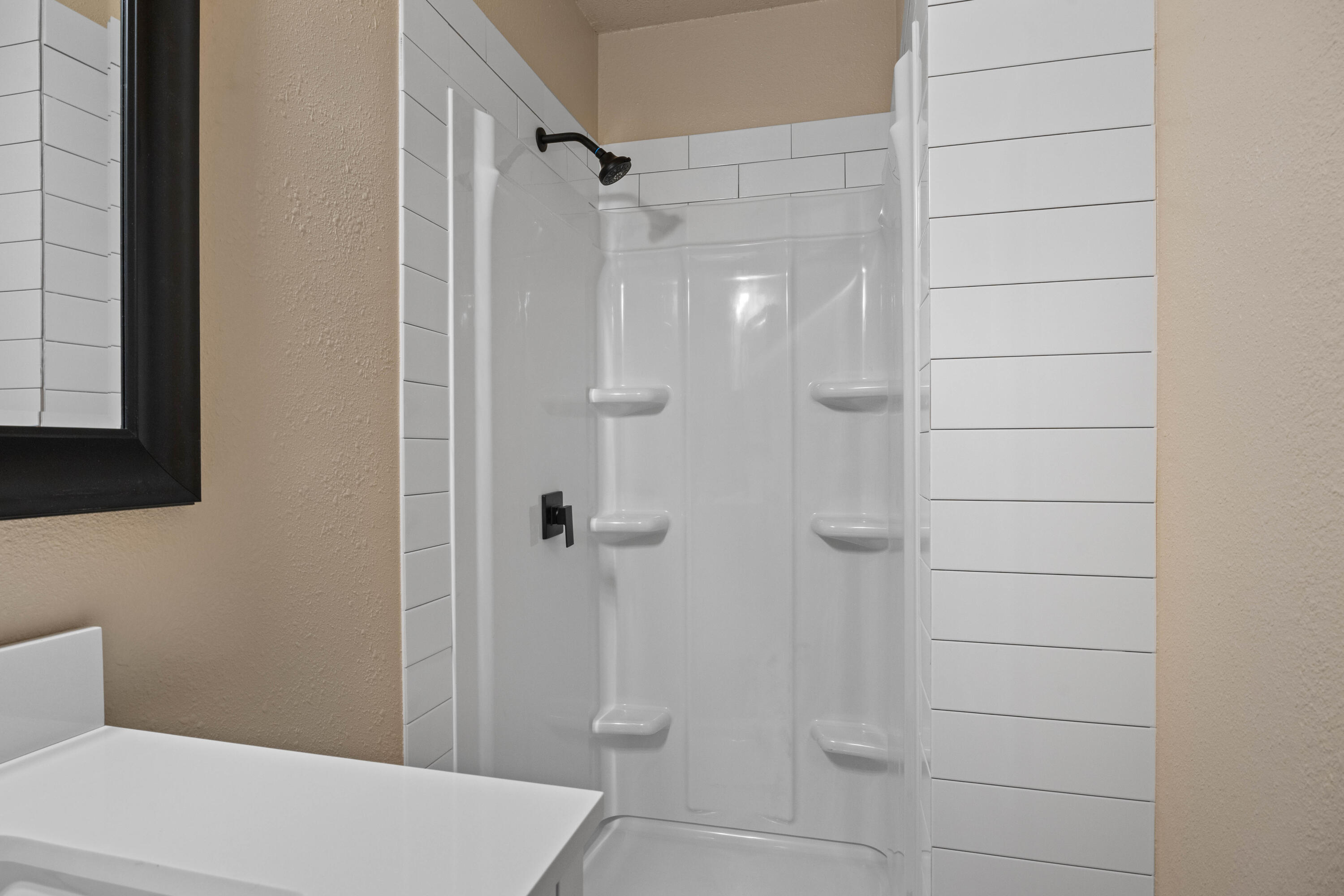 3514 25th Street Lubbock, TX 79410 - Photo 15 of 27 a bathroom with a shower and a toilet