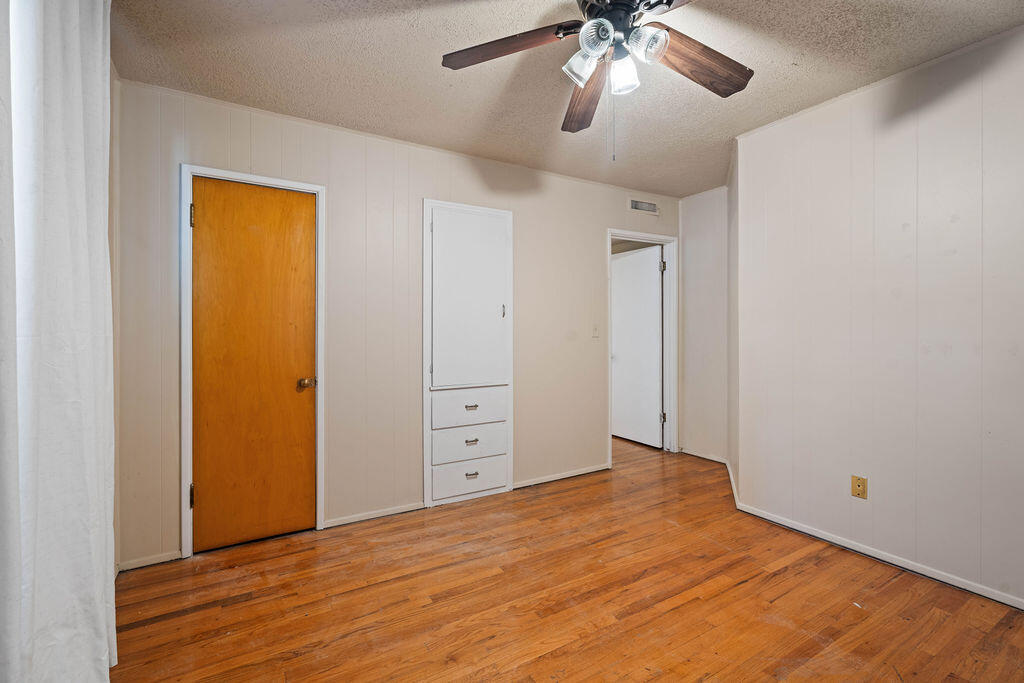 3514 25th Street Lubbock, TX 79410 - Photo 17 of 27 a view of empty room with wooden floor