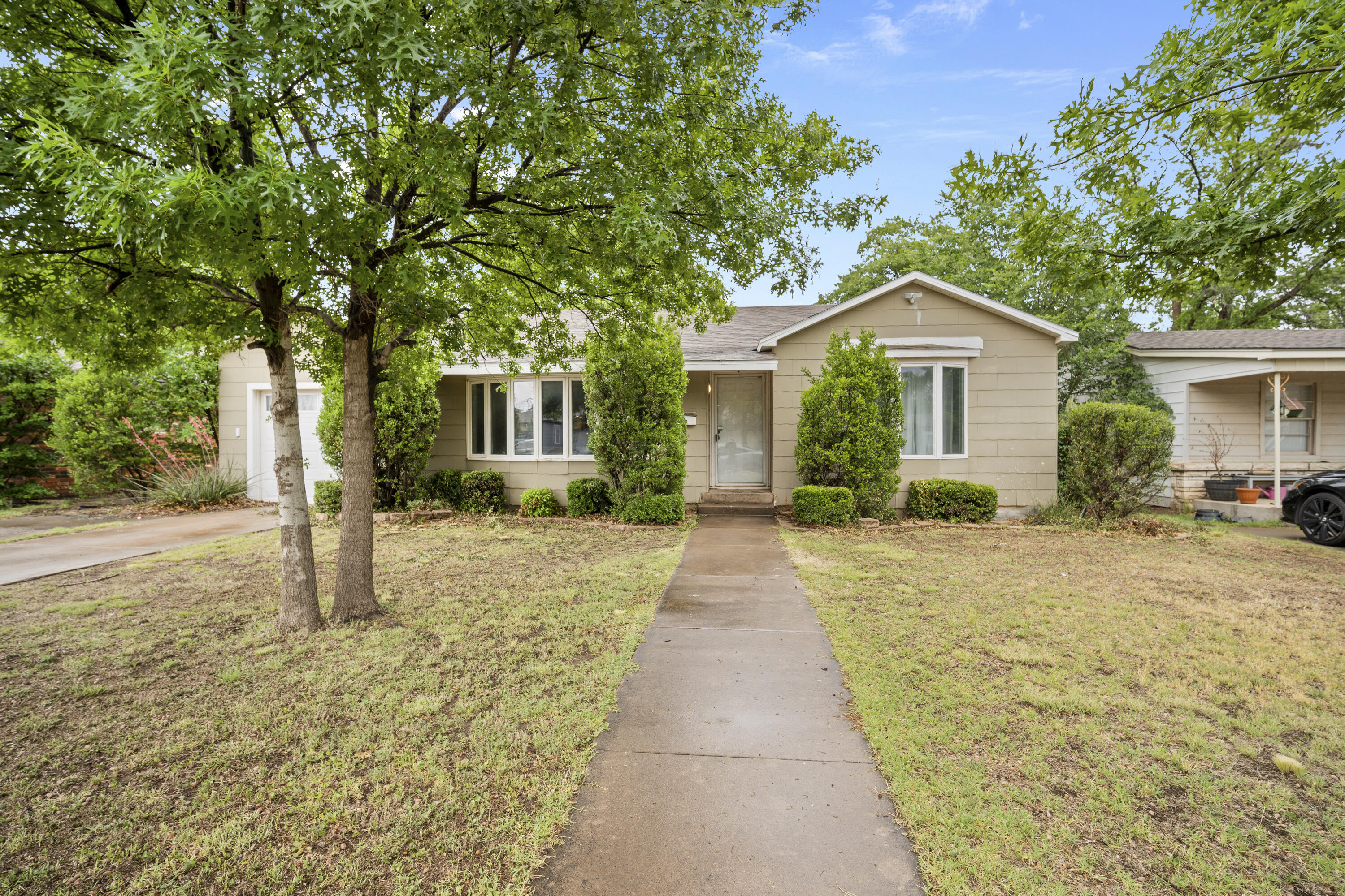 3514 25th Street Lubbock, TX 79410 - Photo 22 of 27 a front view of a house with yard