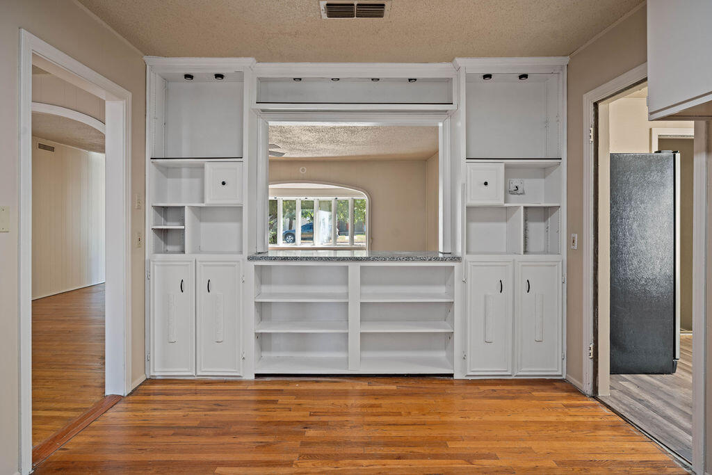 3514 25th Street Lubbock, TX 79410 - Photo 3 of 27 a view of walk in closet with empty racks