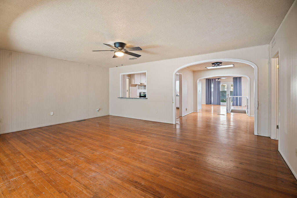 3514 25th Street Lubbock, TX 79410 - Photo 4 of 27 a view of a room with wooden floor and ceiling fan