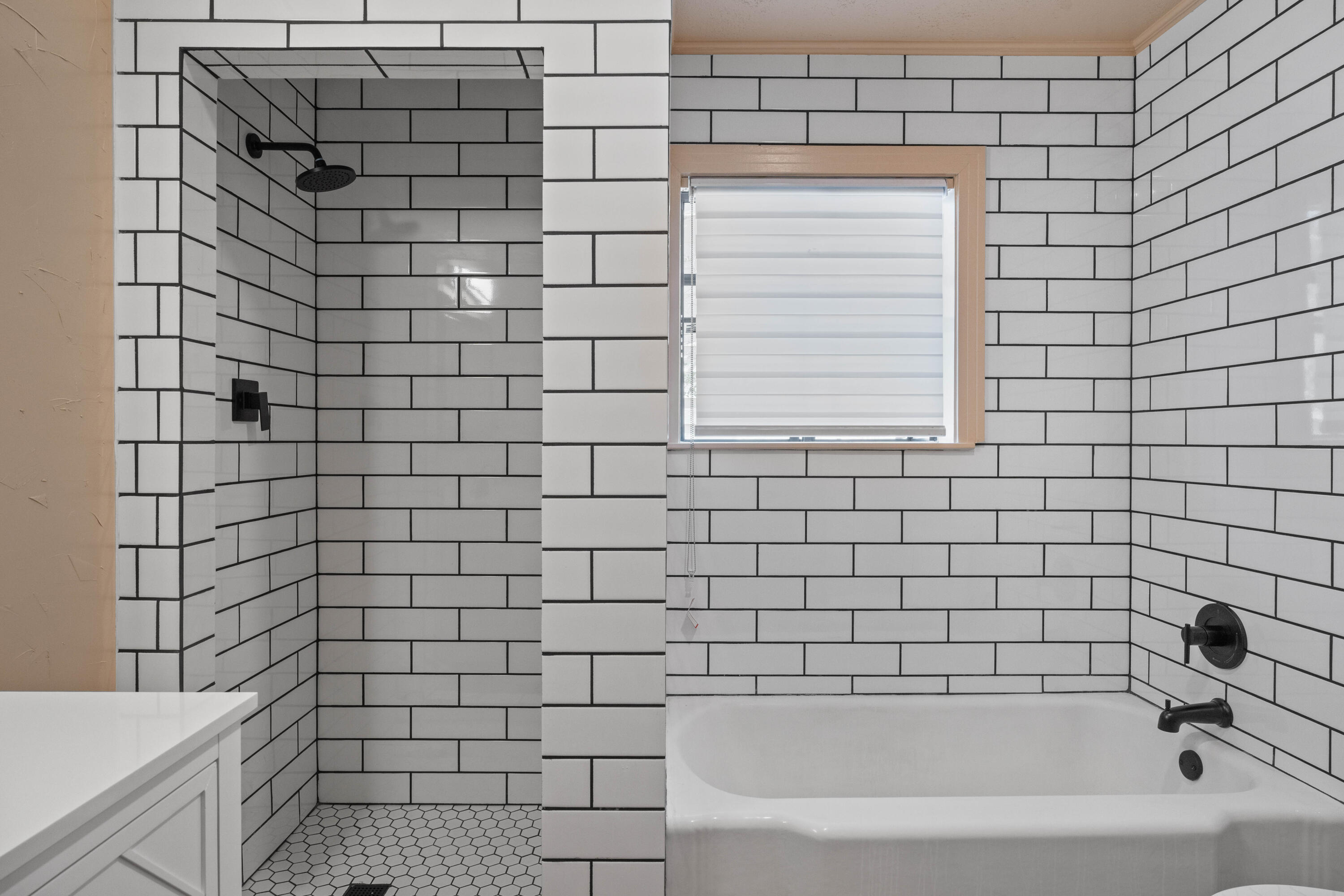 3514 25th Street Lubbock, TX 79410 - Photo 9 of 27 a bathroom with a bathtub and shower