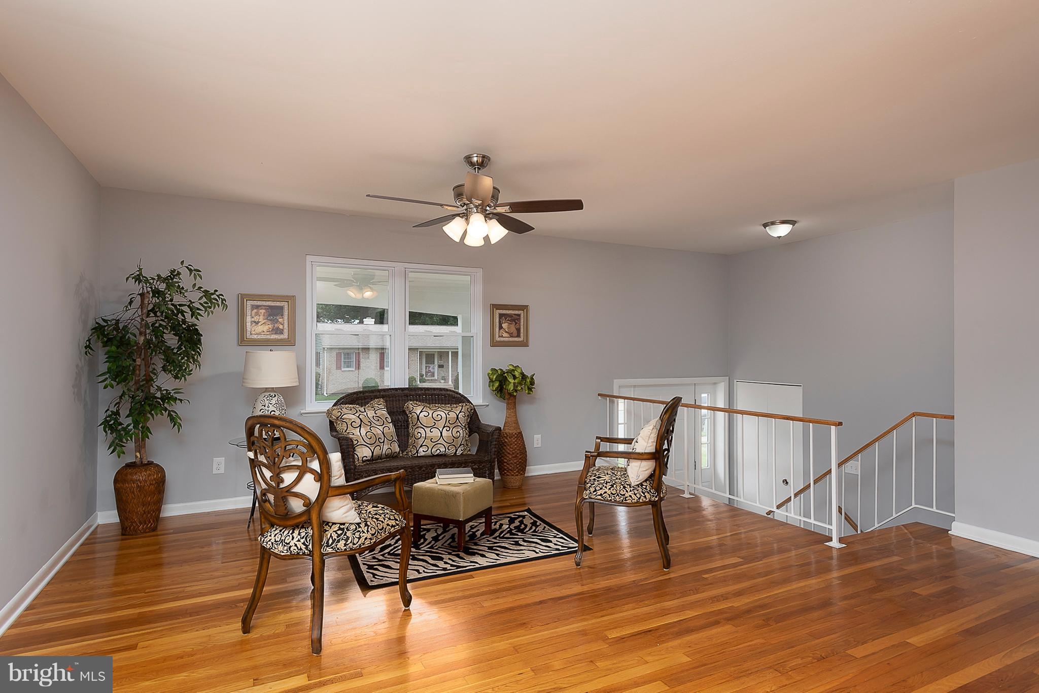 1316 Gatefield Road Baltimore, MD 21228 - Photo 5 of 30 a work room with furniture and wooden floor