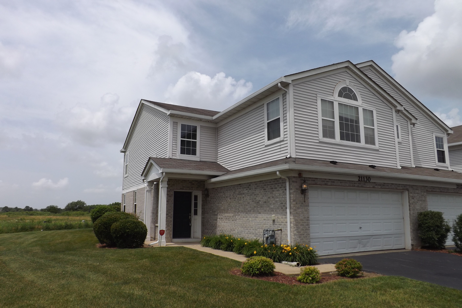 21130 Gray Hawk Drive Matteson, IL 60443 - Photo 1 of 14 a front view of a house with a yard